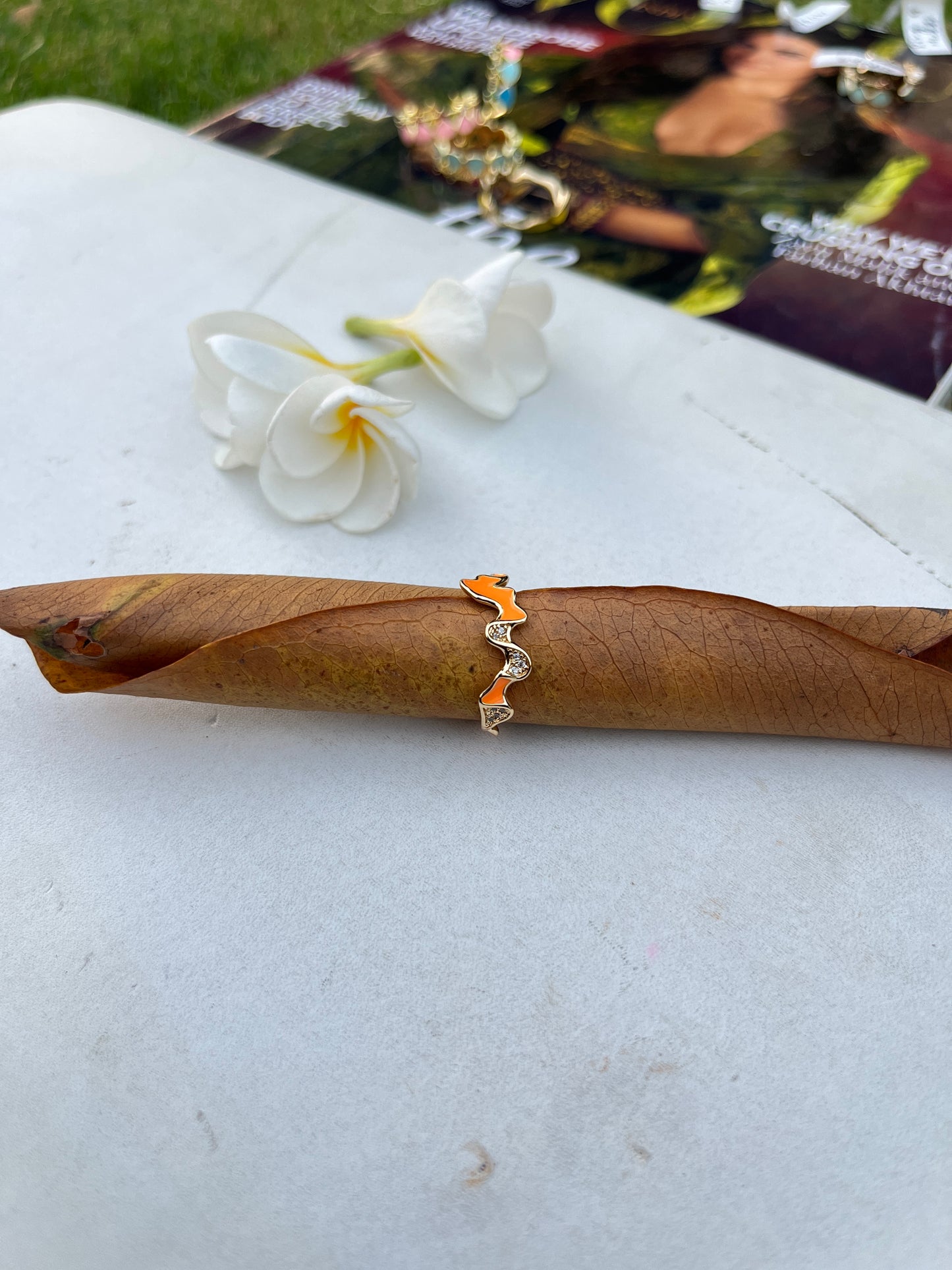 Ring with Orange Enamel Detail